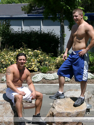 Muscular gay studs Tommy D & Hoyce flaunting their mighty chests outdoors