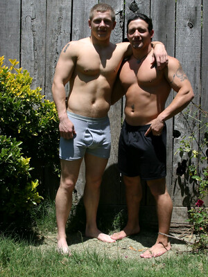 Muscular gay studs Tommy D & Hoyce flaunting their mighty chests outdoors