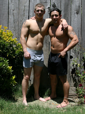 Muscular gay studs Tommy D & Hoyce flaunting their mighty chests outdoors