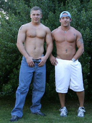 Muscular gay studs Tommy D & Hoyce flaunting their mighty chests outdoors