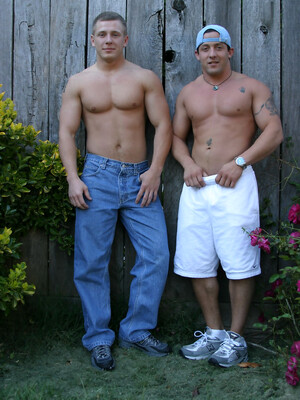 Muscular gay studs Tommy D & Hoyce flaunting their mighty chests outdoors